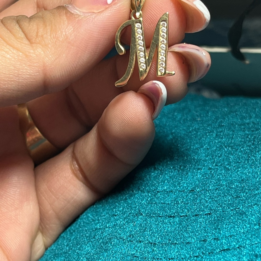 Selling this M letter pendant